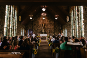 Image of congregation members in a church worshiping.